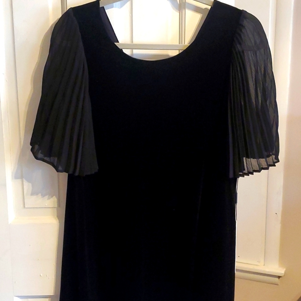 NWT black velvet dress. Just in time for the Holidays.  Sits above knee. Stretch